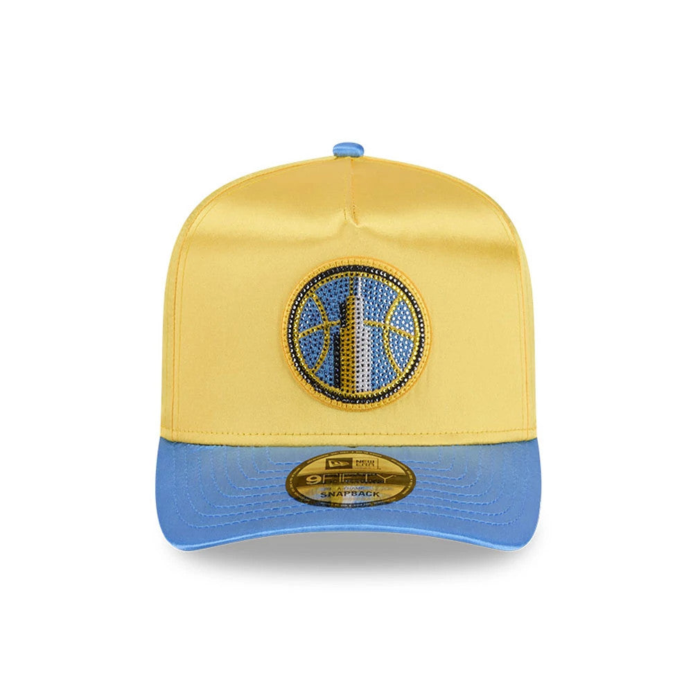 Sky WNBA Draft 2026 Yellow New Era 9FIFTY A-Frame Snapback Adjustable Cap, front view showing a detailed blue and yellow basketball logo embroidered on the front panel, a curved blue visor, and a 9FIFTY size sticker.