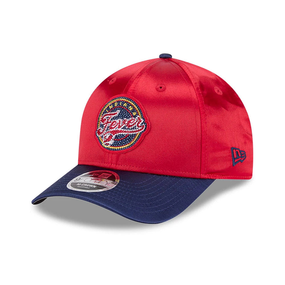 Indiana Fever WNBA Draft 2026 Red New Era 9FORTY M-Crown Adjustable Cap, three-quarter view showing a raised embroidered Indiana Fever logo on the front panel, with a contrasting navy blue curved visor and a 9FORTY size sticker.