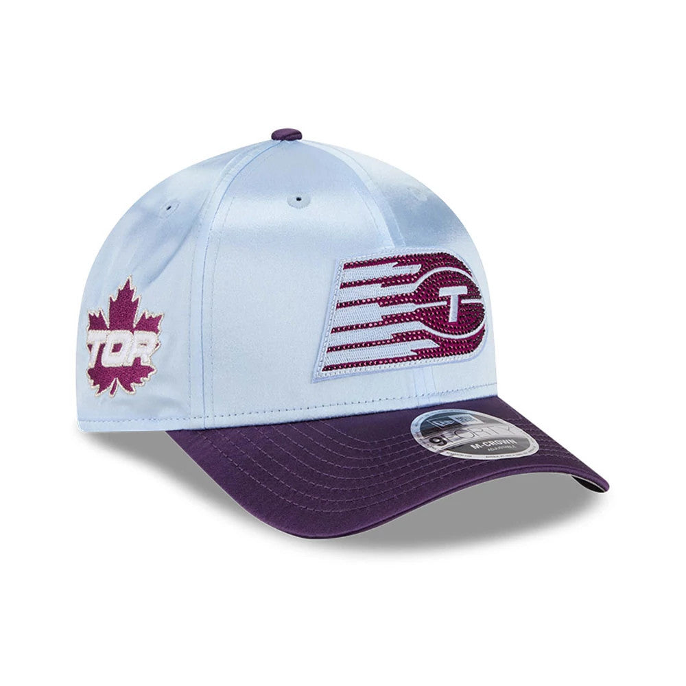 Toronto Tempo WNBA Draft 2026 Pastel Blue New Era 9FORTY M-Crown Adjustable Cap, front view showing a raised embroidered front logo with maroon T design, a maroon visor with a 9FORTY size sticker, and TOR leaf design on the left side.