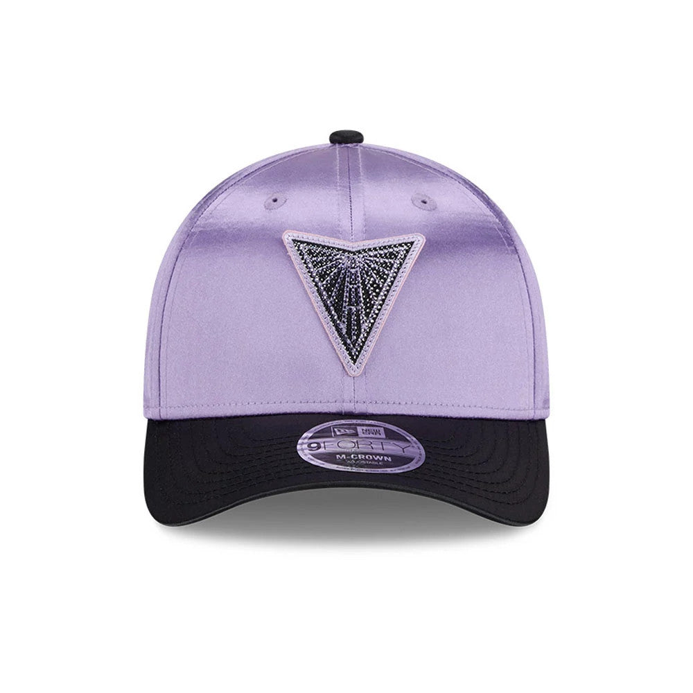 Valkyries WNBA Draft 2026 Pastel Purple New Era 9FORTY M-Crown Adjustable Cap, front view showing a black and silver triangular logo embroidered on the structured pastel purple crown, with a curved black visor and a 9FORTY size sticker.