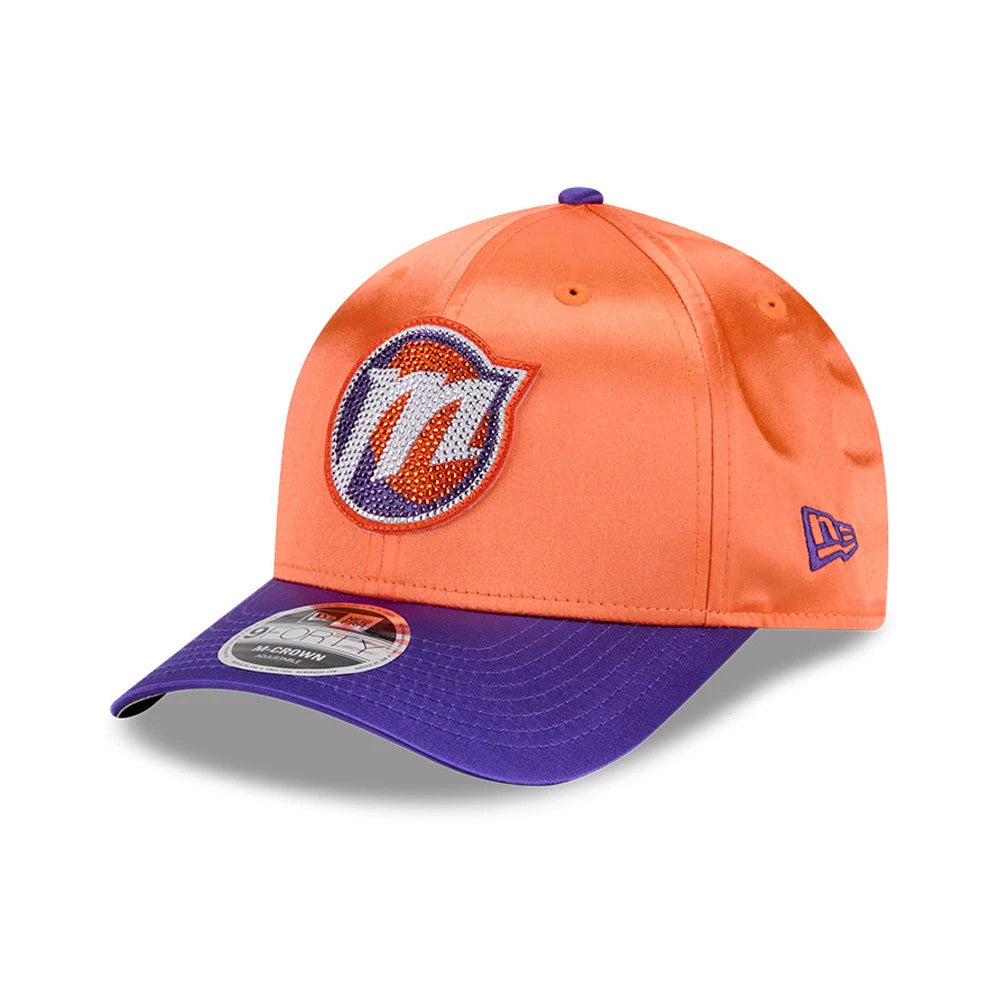 Phoenix Mercury WNBA Draft 2026 Orange New Era 9FORTY M-Crown Adjustable Cap, three-quarter view showing the embroidered team logo on the front panels, a purple visor with a 9FORTY size sticker, and the New Era flag logo on the left side.