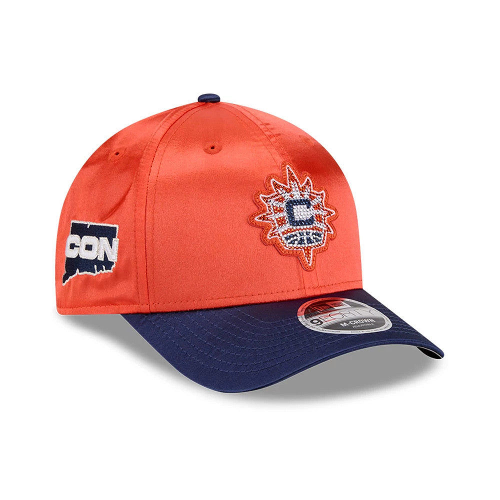 Connecticut Sun WNBA Draft 2026 Orange New Era 9FORTY M-Crown Adjustable Cap, three-quarter view showing the raised embroidered logo on the front panel, navy blue curved visor with a 9FORTY size sticker, and side embroidered CON logo.