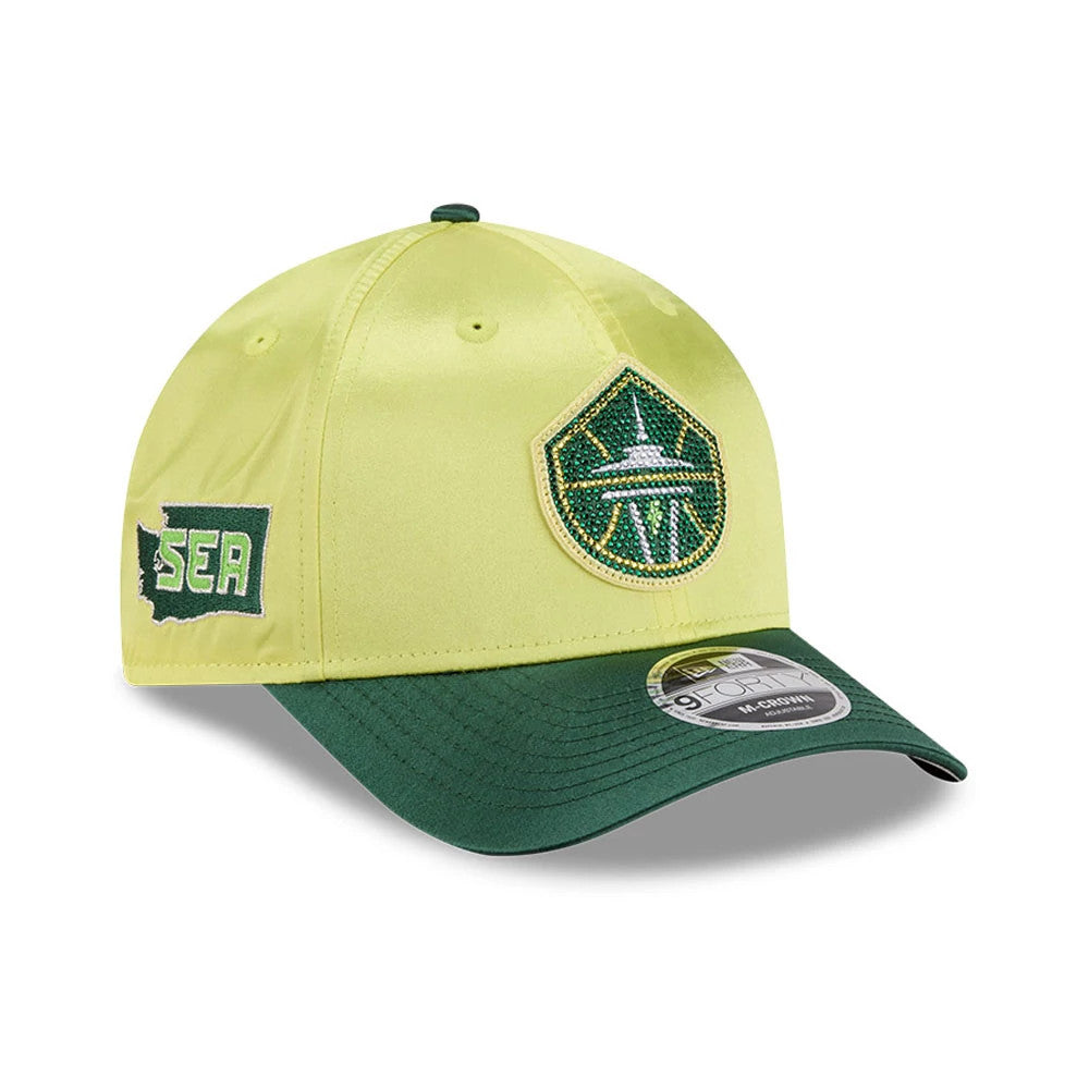 Seattle Storm WNBA Draft 2026 Yellow New Era 9FORTY M-Crown Adjustable Cap, front and side view showing a green and white embroidered Space Needle logo on the front panel, contrasting green curved visor with 9FORTY size sticker, and SEA side patch.
