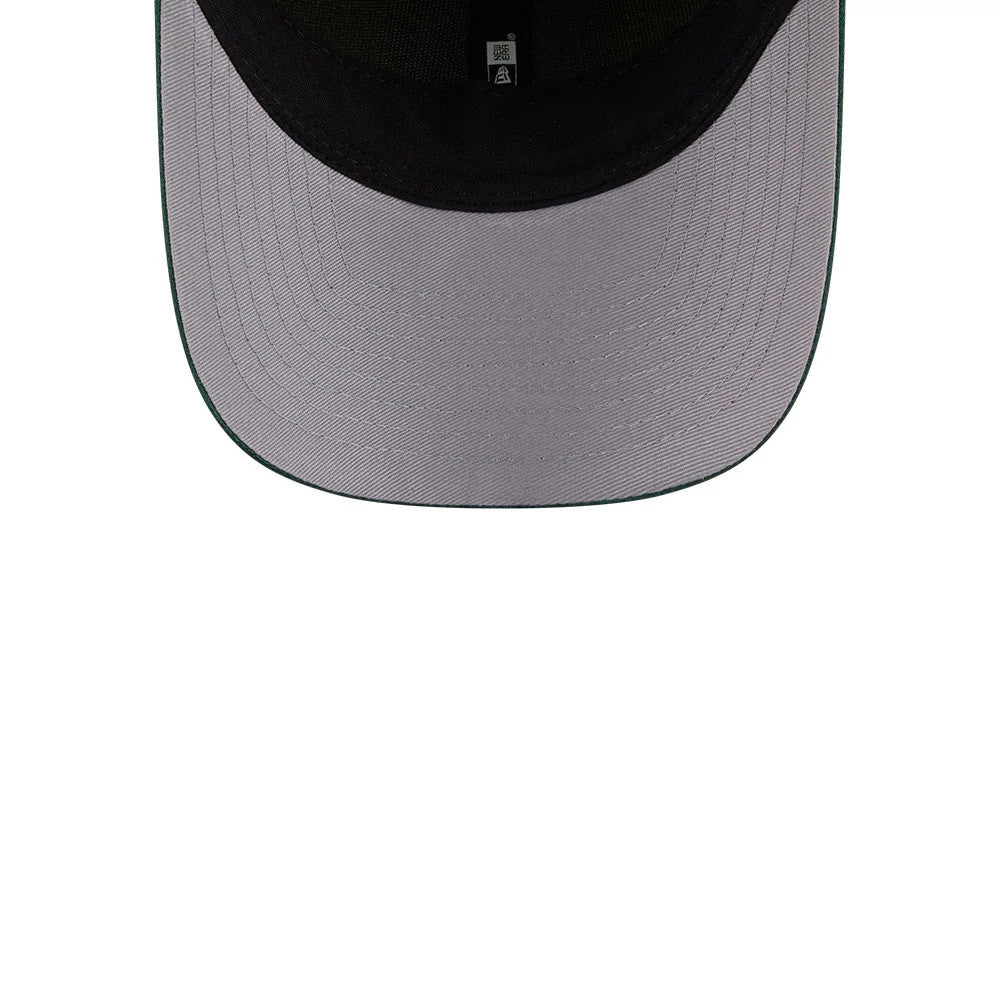 Seattle Storm WNBA Draft 2026 Yellow New Era 9FORTY M-Crown Adjustable Cap, inside view showing the light grey undervisor, black sweatband, and black taping running across the interior crown, creating a contrast with the cap's structure.