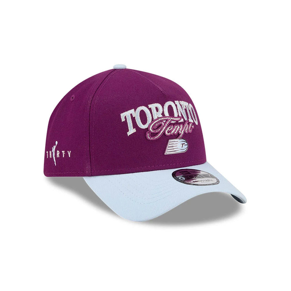 Toronto Tempo WNBA Tip Off 2026 Dark Red New Era 9FORTY A-Frame Adjustable Cap, three-quarter view showing raised white Toronto Tempo embroidery on dark red front panel, light blue curved visor with 9FORTY size sticker.