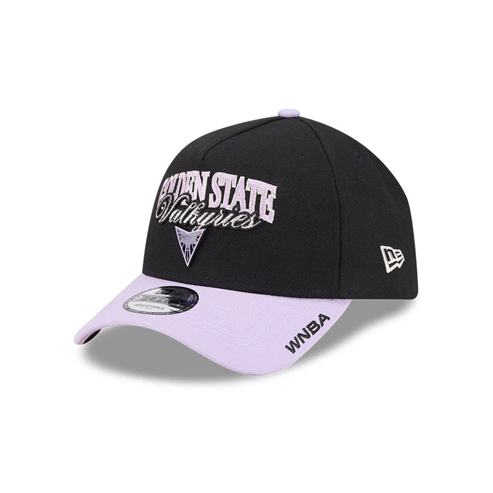 Golden State Valkyries WNBA Tip Off 2026 Black New Era 9FORTY A-Frame Adjustable Cap, three-quarter view showing the raised embroidery on the front panel, a lavender visor with a 9FORTY size sticker, and the white New Era flag logo on the left side.