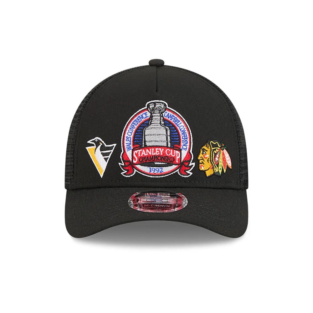 Penguins NHL Stanley Cup Black New Era 9FORTY M-Crown A-Frame Trucker Adjustable Cap, front view showing the central embroidered 1992 Stanley Cup Champions logo, with Penguins and Blackhawks logos on either side.