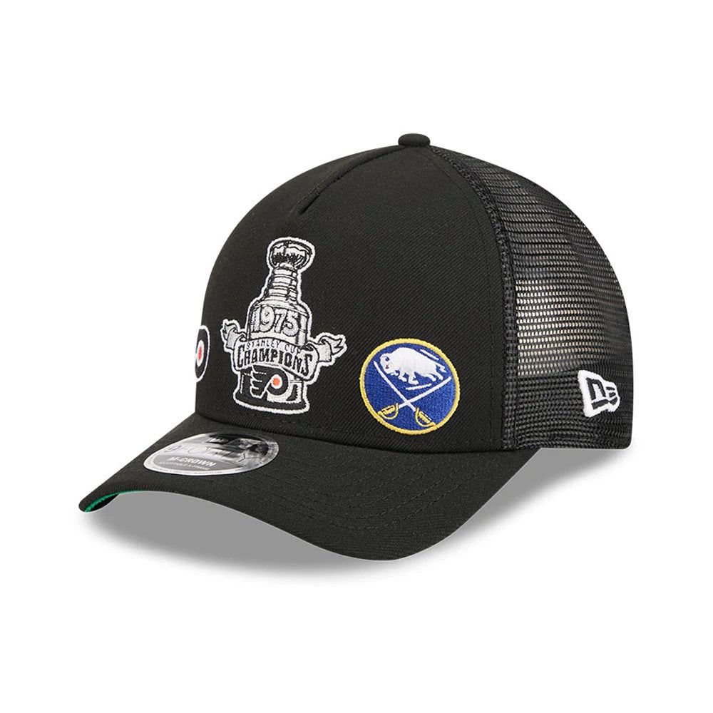 Flyers NHL Stanley Cup Black New Era 9FORTY M-Crown A-Frame Trucker Adjustable Cap, three-quarter view with a prominent embroidered 1975 Stanley Cup Champions graphic on the front panel, team logos, and black mesh rear panels.