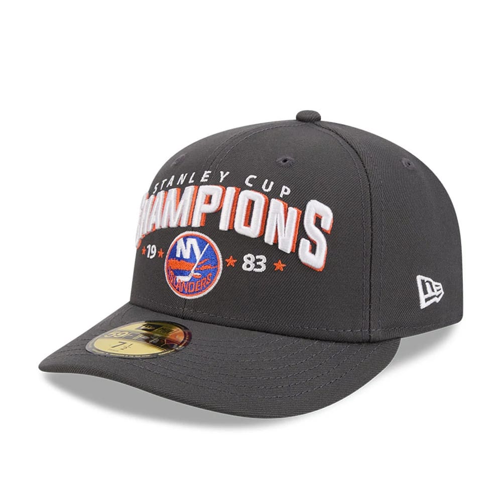 New York Islanders NHL Stanley Cup Champions Dark Grey New Era 59FIFTY Fitted Cap, three-quarter view showing the white and orange embroidered Champions lettering on the front panel, with the New York Islanders logo below.