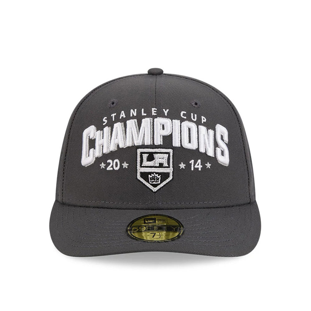 LA Kings NHL Stanley Cup Champions Dark Grey New Era 59FIFTY Fitted Cap, front view showing the white raised embroidered Stanley Cup Champions lettering and LA Kings shield logo, with 2014 date embroidery.