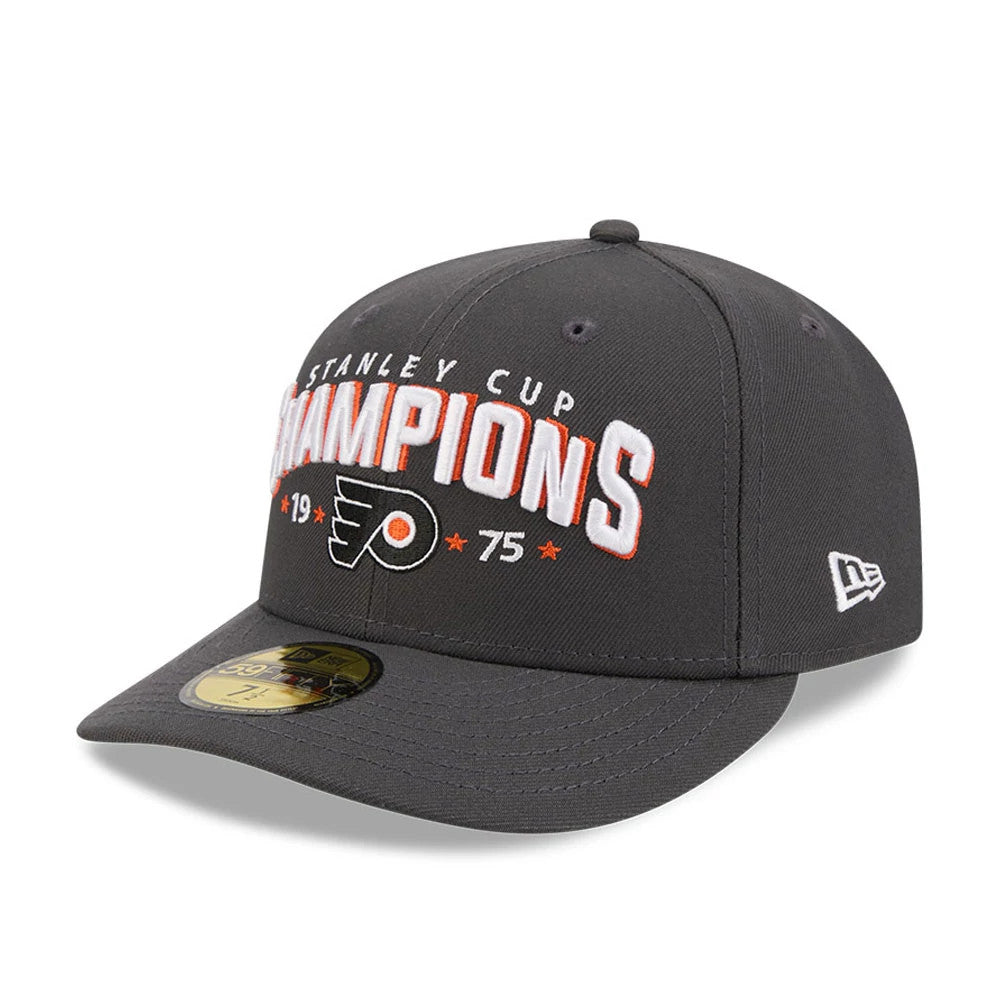 Philadelphia Flyers NHL Stanley Cup Champions Dark Grey New Era 59FIFTY Fitted Cap, three-quarter view showing raised STANLEY CUP CHAMPIONS embroidery in white and orange on front panels, Flyers logo beneath.
