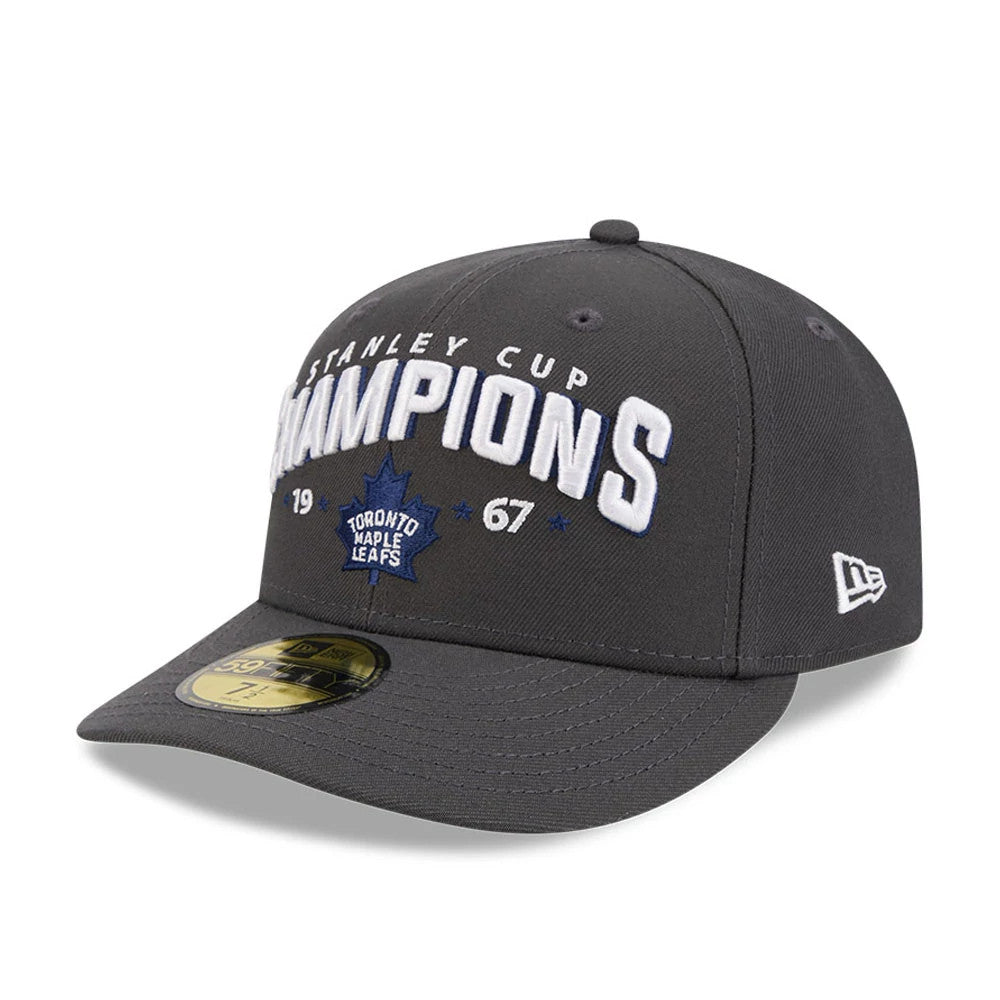 Toronto Maple Leafs NHL Stanley Cup Champions Dark Grey New Era 59FIFTY Fitted Cap, front view showing raised white and blue embroidery with Champions and team logo, a structured dark grey crown with matching curved visor.