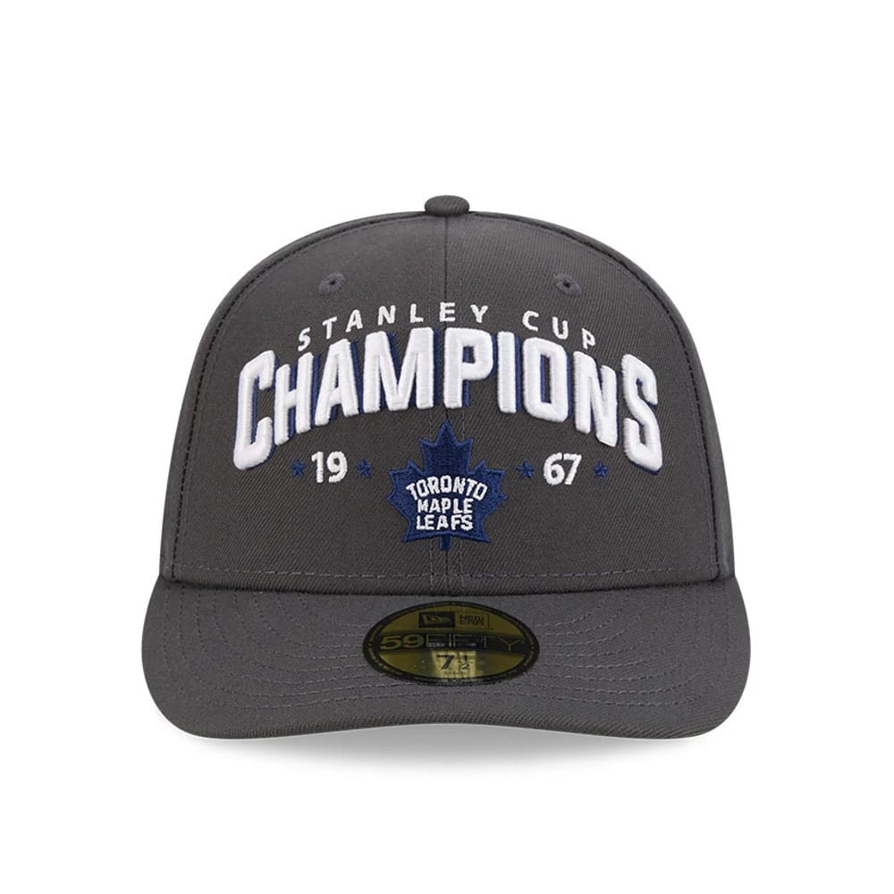 Toronto Maple Leafs NHL Stanley Cup Champions Dark Grey New Era 59FIFTY Fitted Cap, front view showing raised white embroidered Stanley Cup Champions lettering across the structured dark grey crown, blue team logo.