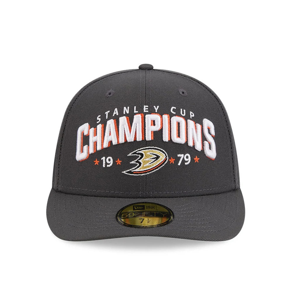 Anaheim Ducks NHL Stanley Cup Champions Dark Grey New Era 59FIFTY Fitted Cap, front view showing the white and orange embroidered STANLEY CUP CHAMPIONS lettering and Ducks logo on the structured dark grey crown.