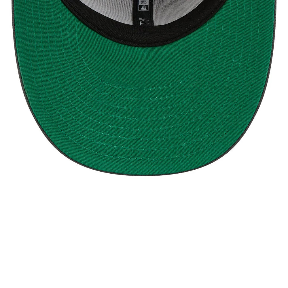 Anaheim Ducks NHL Stanley Cup Champions Dark Grey New Era 59FIFTY Fitted Cap, inside view showing the green undervisor contrasted by a black sweatband, with interior black taping featuring white logos in a repeating pattern.