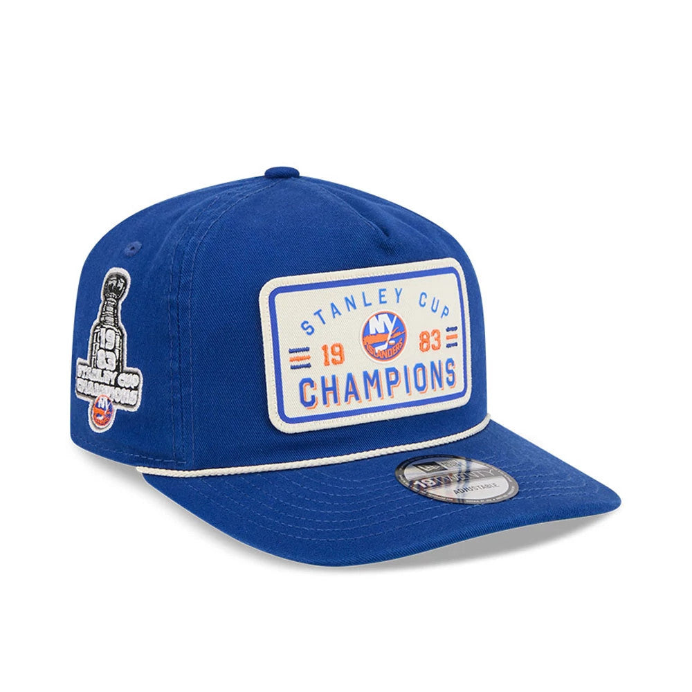 New York Islanders NHL Stanley Cup Champions Blue New Era 19TWENTY Adjustable Cap, three-quarter view showing a large embroidered patch with Stanley Cup Champions lettering on the front panel, a side patch featuring the Stanley Cup trophy.