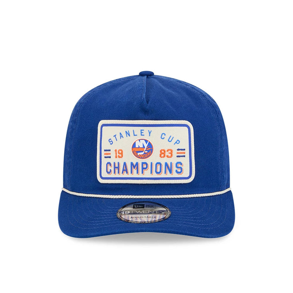 New York Islanders NHL Stanley Cup Champions Blue New Era 19TWENTY Adjustable Cap, front view showing a rectangular embroidered patch with Stanley Cup Champions and the team's logo, a blue flat visor with white piping, and a 19TWENTY size sticker.