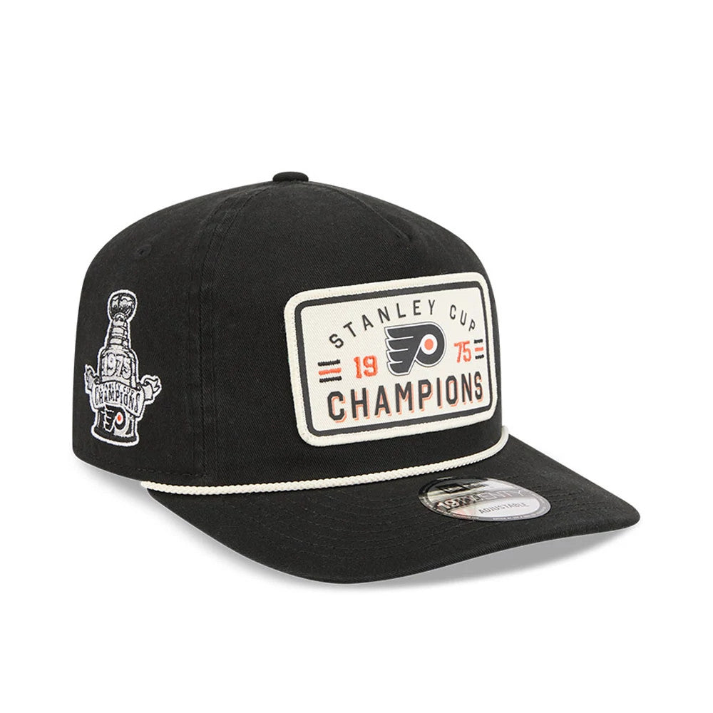 Philadelphia Flyers NHL Stanley Cup Champions Black New Era 19TWENTY Adjustable Cap, three-quarter view showing a large embroidered patch on the front panel featuring Flyers' logo, red and black lettering, a side graphic of the Stanley Cup.