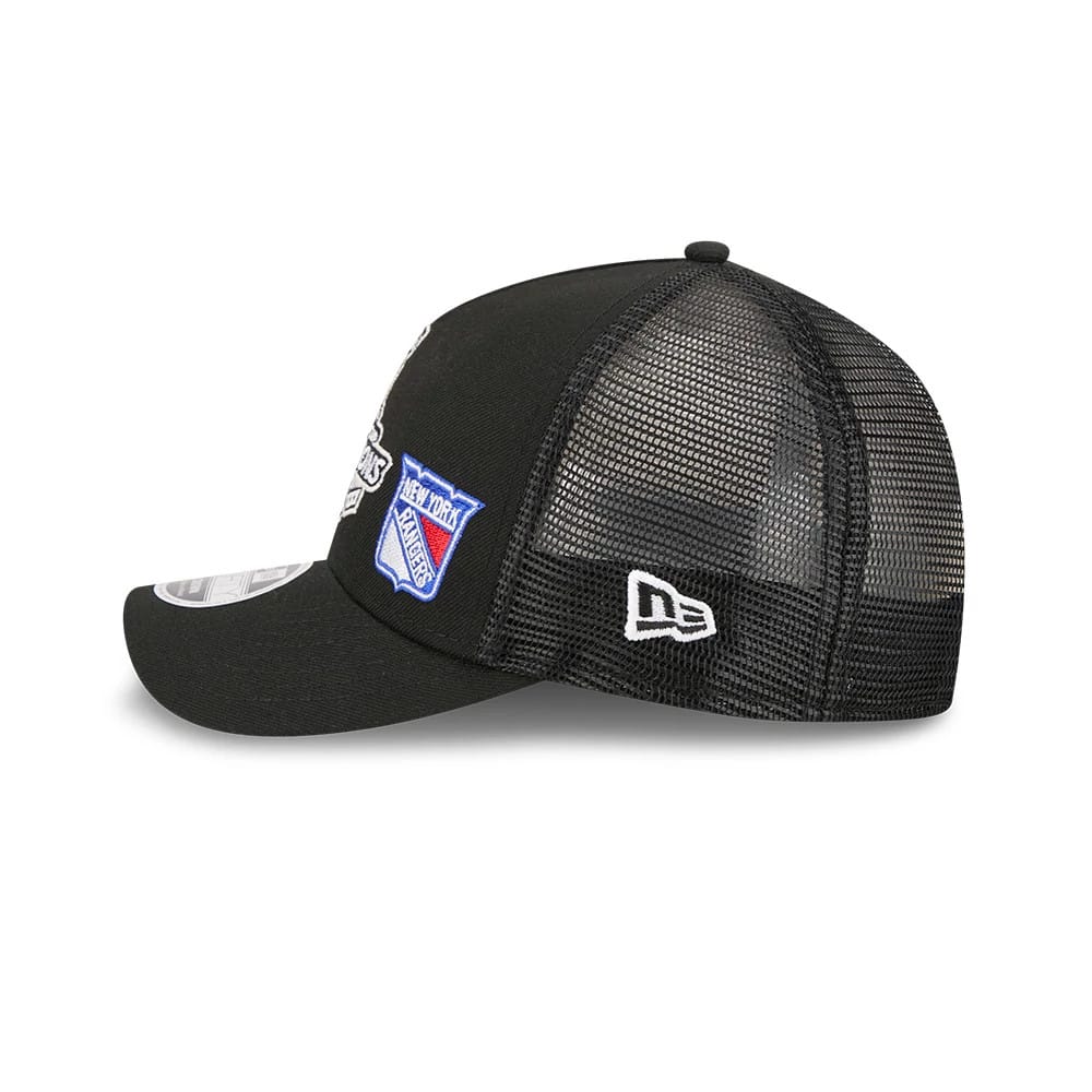 Kings NHL Stanley Cup Black New Era 9FORTY M-Crown A-Frame Trucker Adjustable Cap, side view showing white New Era flag logo on the black mesh rear panels, structured front with team patches, and a curved black visor with a 9FORTY size sticker.