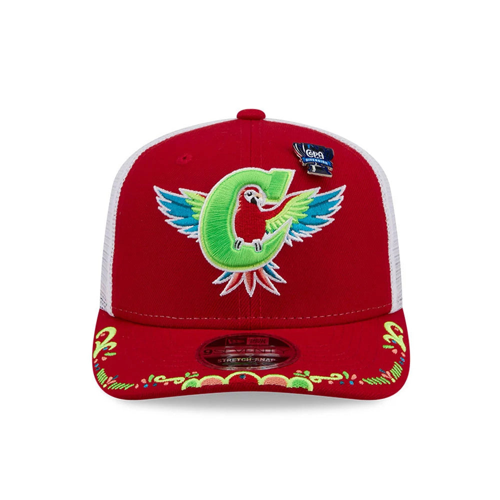 Charlotte Knights MiLB La Copa 2026 Red New Era 9SEVENTY Stretch Snap Adjustable Cap, front view showing an embroidered parrot and letter C on the structured red crown, with decorative embellishments on the visor and a 9SEVENTY size sticker.
