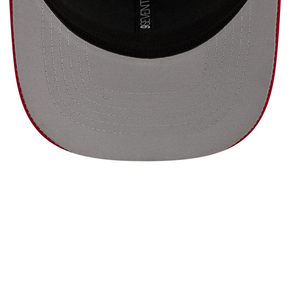 Charlotte Knights MiLB La Copa 2026 Red New Era 9SEVENTY Stretch Snap Adjustable Cap, inside view showing a grey undervisor with red edge detail, black sweatband, and the New Era 9SEVENTY logo printed on the inner taping.