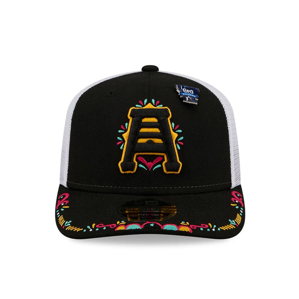 SLC Bee MiLB La Copa 2026 Black New Era 9SEVENTY Stretch Snap Adjustable Cap, front view showcasing a yellow embroidered A logo with colourful decorative accents on the black crown and visor, and a New Era size sticker on the visor.