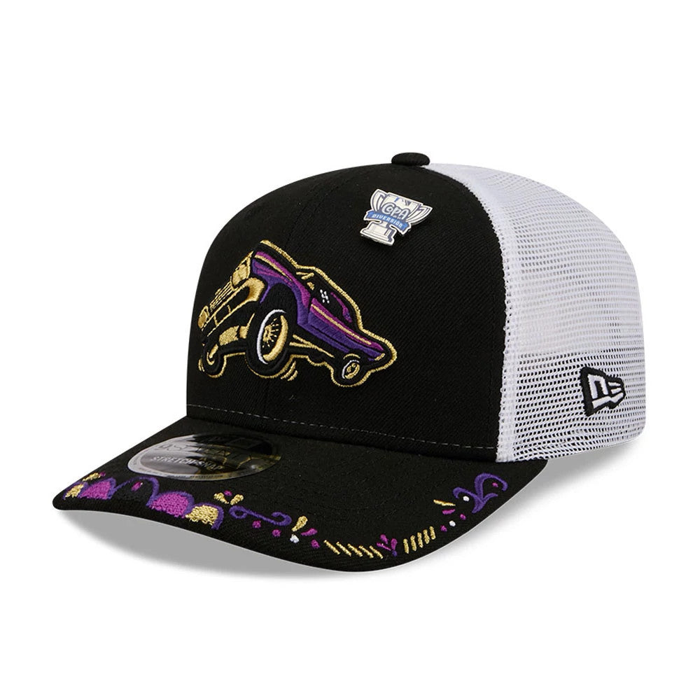 Grizzlies MiLB La Copa 2026 Black New Era 9SEVENTY Stretch Snap Adjustable Cap, three-quarter view showing a purple and gold embroidered car on the black front panel, decorative elements on the visor.