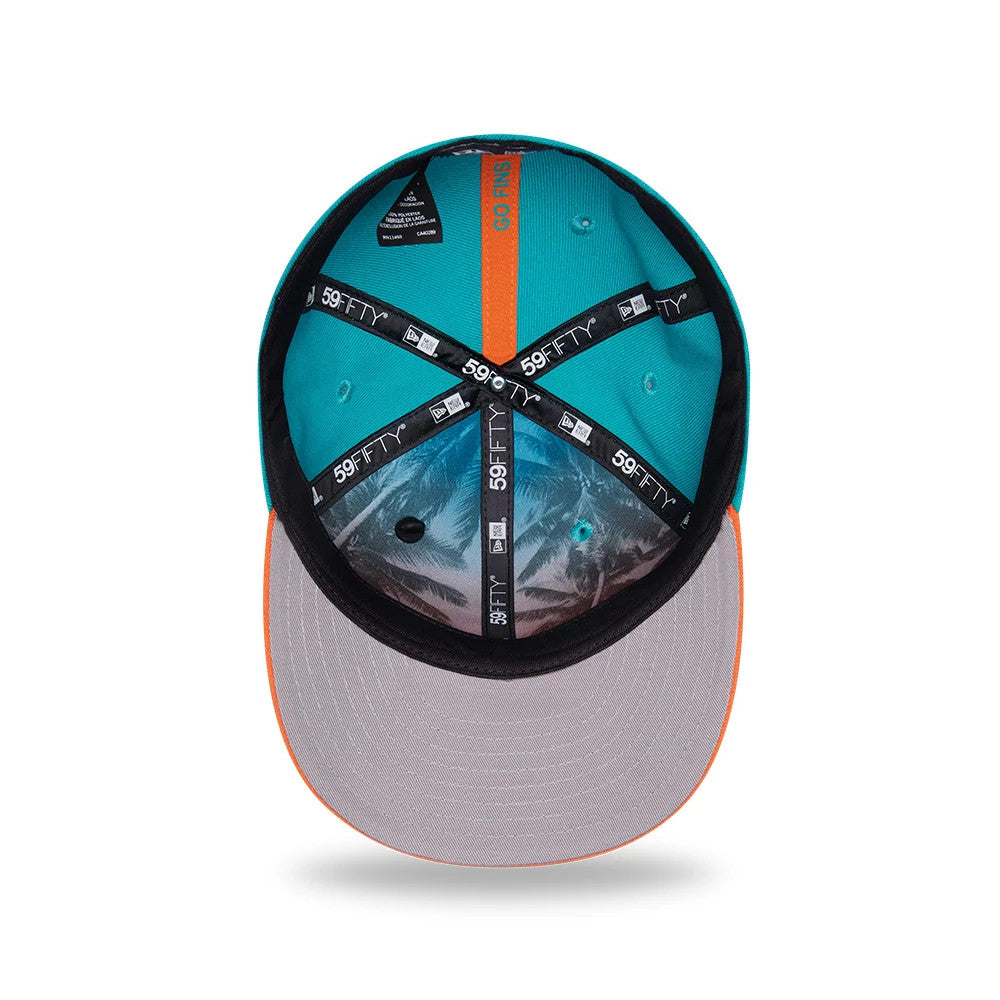 Miami Dolphins NFL Draft 2026 Turquoise New Era 59FIFTY Fitted Cap, inside view showing black 59FIFTY taping, turquoise sweatband with GO FINS text, and a grey undervisor with a palm tree print.