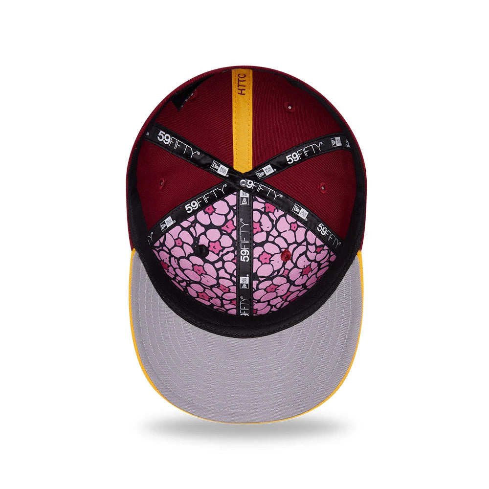 Washington Commanders NFL Draft 2026 Dark Red New Era 59FIFTY Fitted Cap, inside view showing patterned pink undervisor, grey sweatband, and black 59FIFTY taping with logos, set against a dark red crown interior.