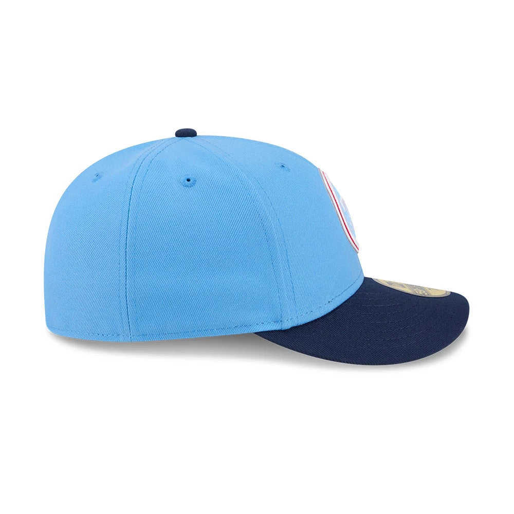 Tennessee Titans NFL Draft 2026 Blue New Era 59FIFTY Fitted Cap, side view showing the embroidered New Era flag logo on the left side of the light blue crown, paired with a contrasting dark blue curved visor and a gold 59FIFTY size sticker.