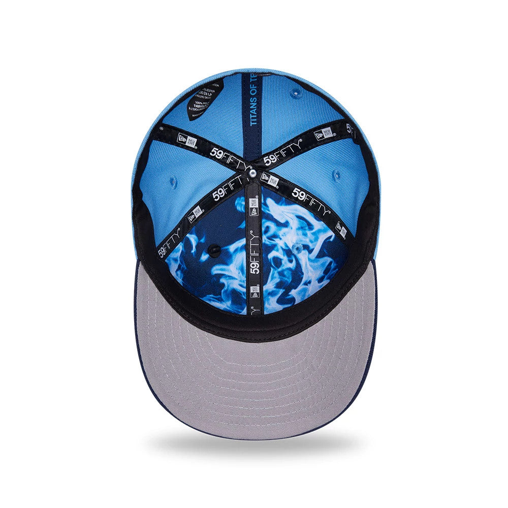 Tennessee Titans NFL Draft 2026 Blue New Era 59FIFTY Fitted Cap, inside view showcasing black 59FIFTY taping, a vivid blue flame pattern on the interior of the crown, and a grey undervisor set against the blue lining.