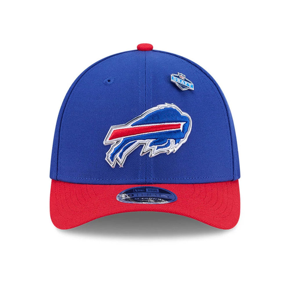 Buffalo Bills NFL Draft 2026 Blue New Era 39THIRTY M-Crown Stretch Fit Cap, front view showing a raised embroidered Bills logo in blue and white on the structured blue crown, a small NFL Draft 2026 pin to the right.