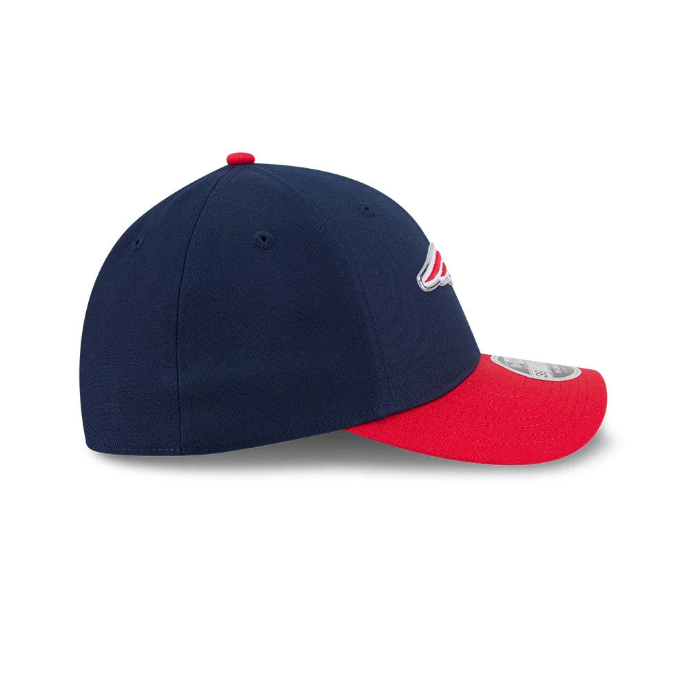 Patriots NFL Draft 2026 Dark Blue New Era 39THIRTY M-Crown Stretch Fit Cap, side view showing the raised white and red front logo, curved red visor with 39THIRTY size sticker, and dark blue structured crown with matching top button.
