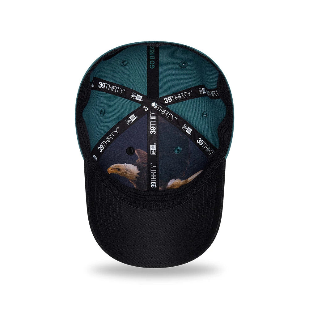 Eagles NFL Draft 2026 Dark Green New Era 39THIRTY M-Crown Stretch Fit Cap, inside view showing black 39THIRTY and New Era branded taping, a dark teal sweatband with Go Birds text, and an eagle graphic on the black undervisor.