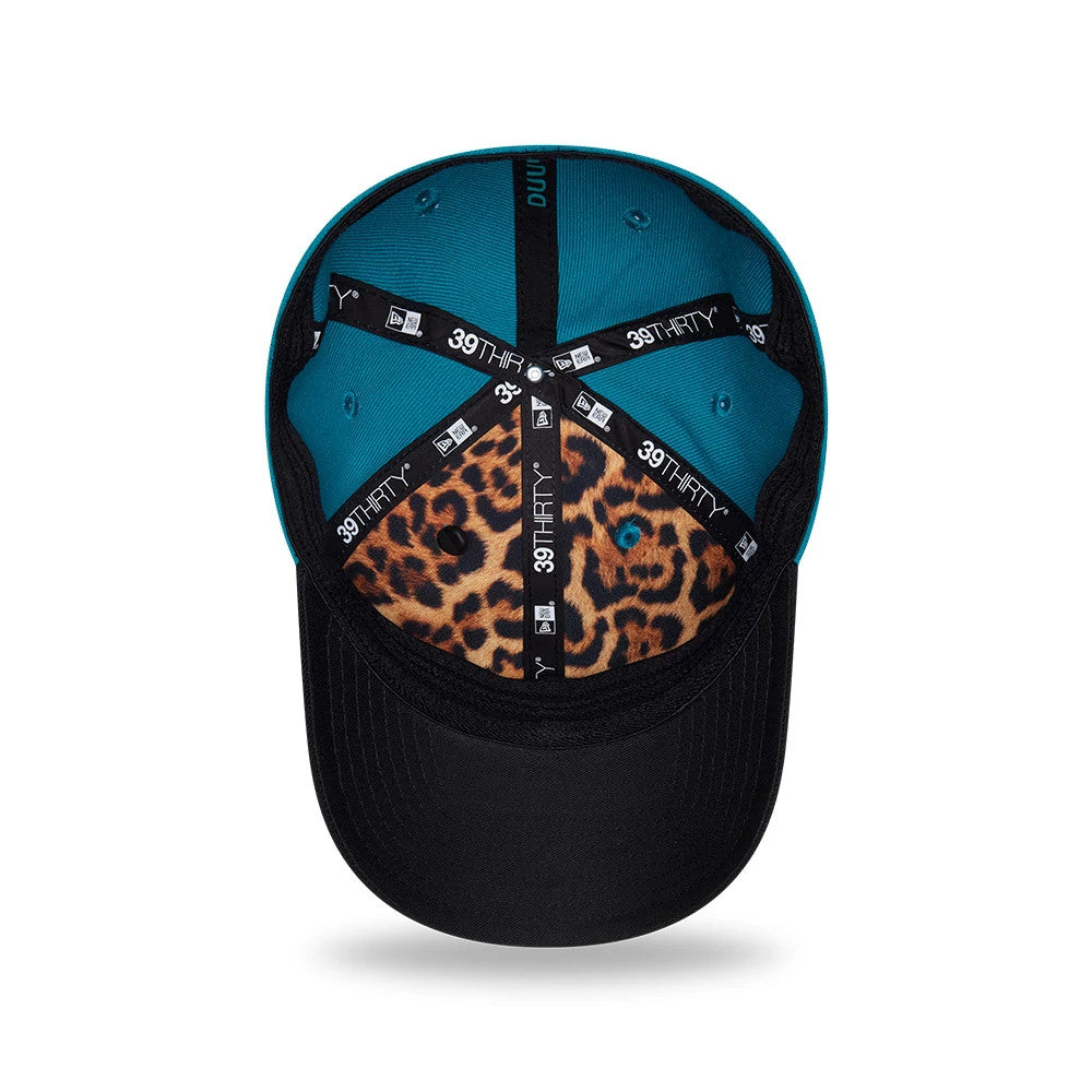Jaguars NFL Draft 2026 Turquoise New Era 39THIRTY M-Crown Stretch Fit Cap, inside view showing the turquoise crown with black taping, a leopard print pattern on the undervisor, black sweatband and evenly spaced eyelets.
