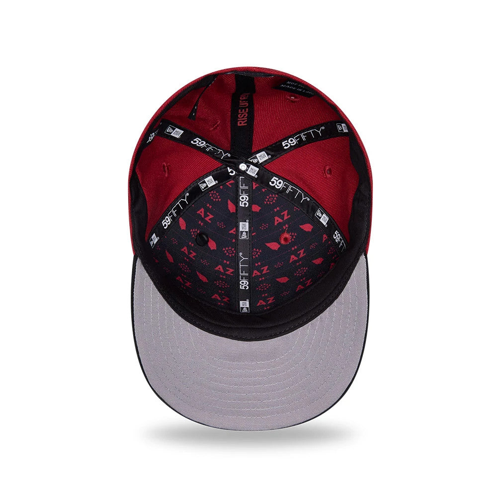 Arizona Cardinals NFL Draft 2026 Dark Red New Era 59FIFTY Fitted Cap, inside view showing black 59FIFTY taping with logos, a contrasting grey undervisor, and AZ patterned fabric lining the interior crown, against a dark red upper section.