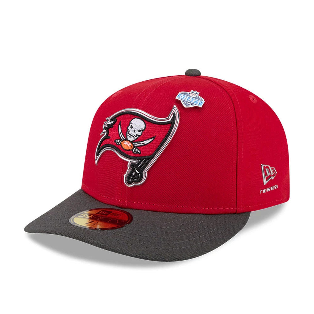 Tampa Bay Buccaneers NFL Draft 2026 Red New Era 59FIFTY Fitted Cap, front view showing raised embroidered Buccaneers logo on red crown, grey visor with gold 59FIFTY size sticker, and small NFL Draft pin near the top button.