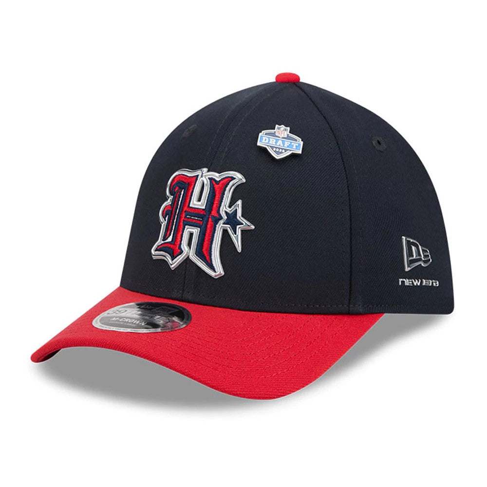 Houston Texans NFL Draft 2026 Navy New Era 39THIRTY M-Crown Stretch Fit Cap, three-quarter view showing the red and white embroidered H logo on the structured navy crown, a blue NFL Draft pin on the front panel.