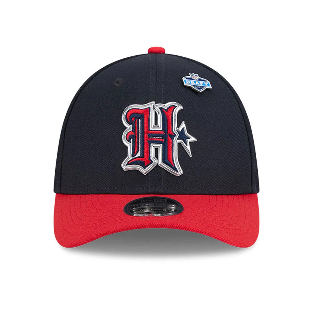 Houston Texans NFL Draft 2026 Navy New Era 39THIRTY M-Crown Stretch Fit Cap, front view showing a prominent red and white embroidered H logo with a star on the navy crown, and featuring a contrasting red visor with a 39THIRTY size sticker.