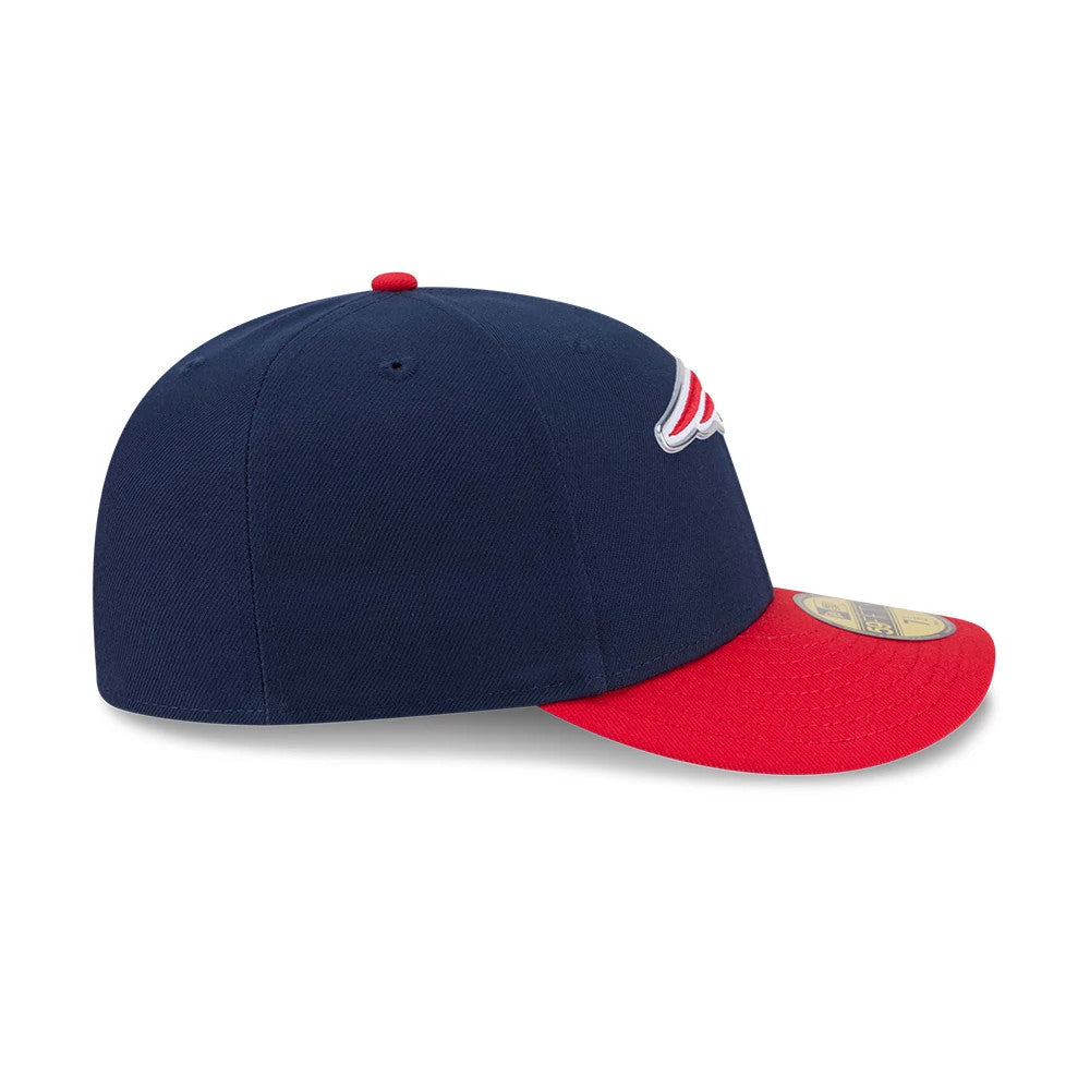 New England Patriots NFL Draft 2026 Dark Blue New Era 59FIFTY Fitted Cap, side view showing an embroidered team logo on the front panel, with a dark blue structured crown, red flat visor, and gold 59FIFTY size sticker on the visor.