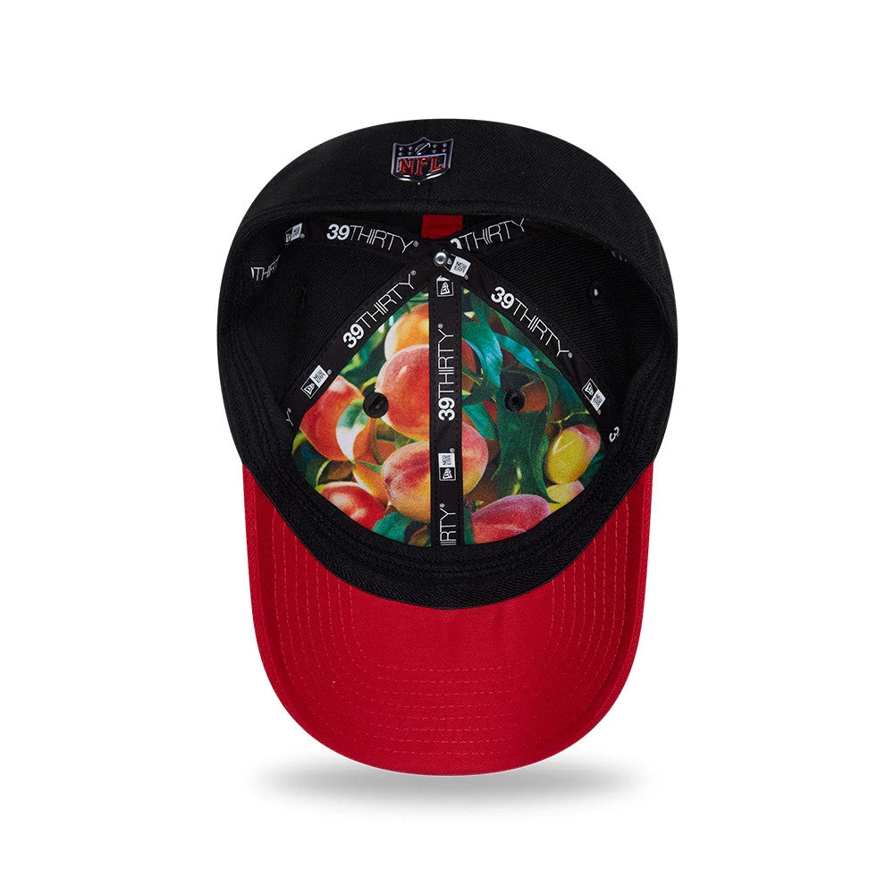 Atlanta Falcons NFL Draft 2026 Black New Era 39THIRTY M-Crown Stretch Fit Cap, inside view showing fruit graphics on the fabric under the crown, 39THIRTY branded taping across the panel seams and a black sweatband lining.