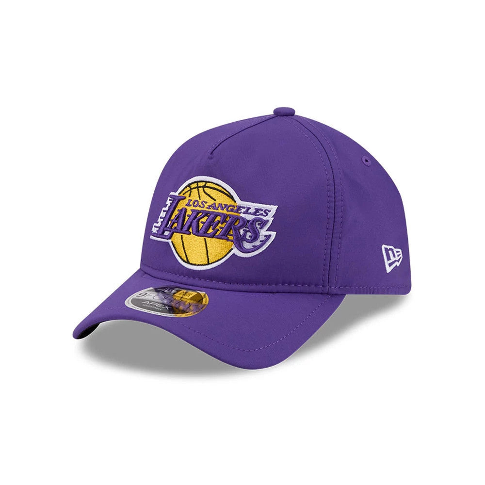 LA Lakers NBA Quickstrike Purple New Era 9FORTY Apex Adjustable Cap, three-quarter view showing the raised embroidery logo in purple, yellow, and white on the front panel, a curved purple visor with a 9FORTY size sticker.