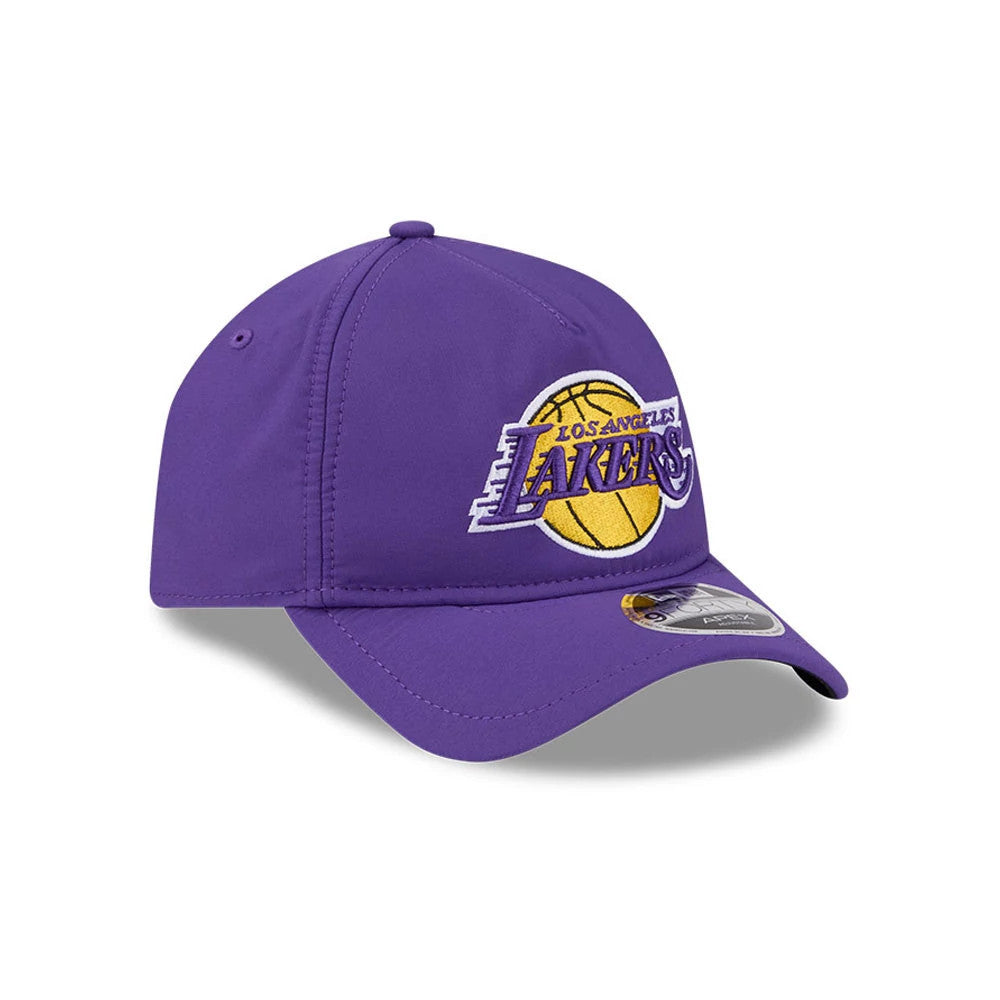 LA Lakers NBA Quickstrike Purple New Era 9FORTY Apex Adjustable Cap, front view showing the raised embroidered LA Lakers logo in yellow and purple on the front panel, with a curved purple visor and 9FORTY size sticker on the visor.