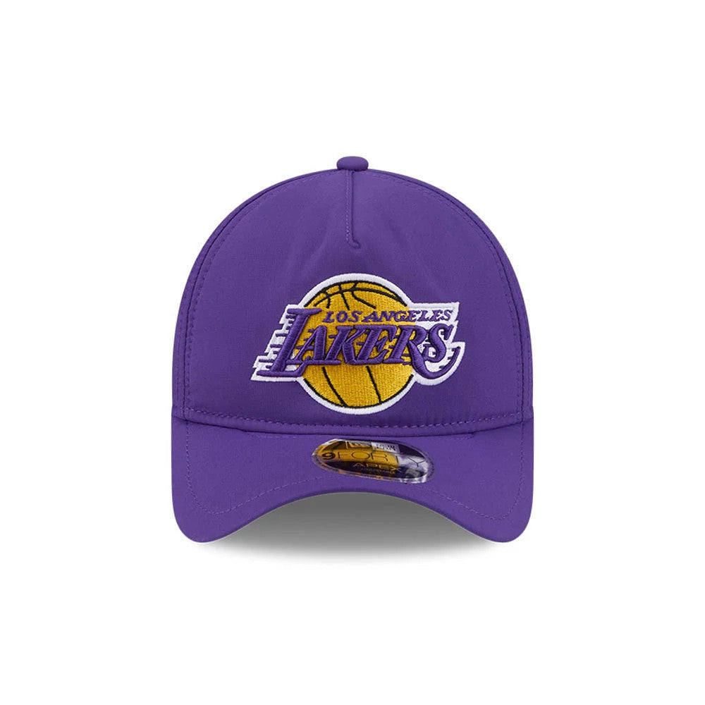 LA Lakers NBA Quickstrike Purple New Era 9FORTY Apex Adjustable Cap, front view showing a raised embroidered Lakers logo in gold and white on the structured purple crown, with a curved visor featuring a 9FORTY size sticker centred beneath the logo.
