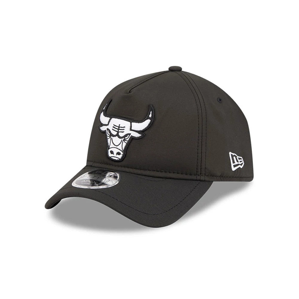 Chicago Bulls NBA Quickstrike Black New Era 9FORTY Apex Adjustable Cap, three-quarter view showing the raised black and white embroidered bull logo on the front, a curved black visor with 9FORTY size sticker, and New Era flag logo on the left side.
