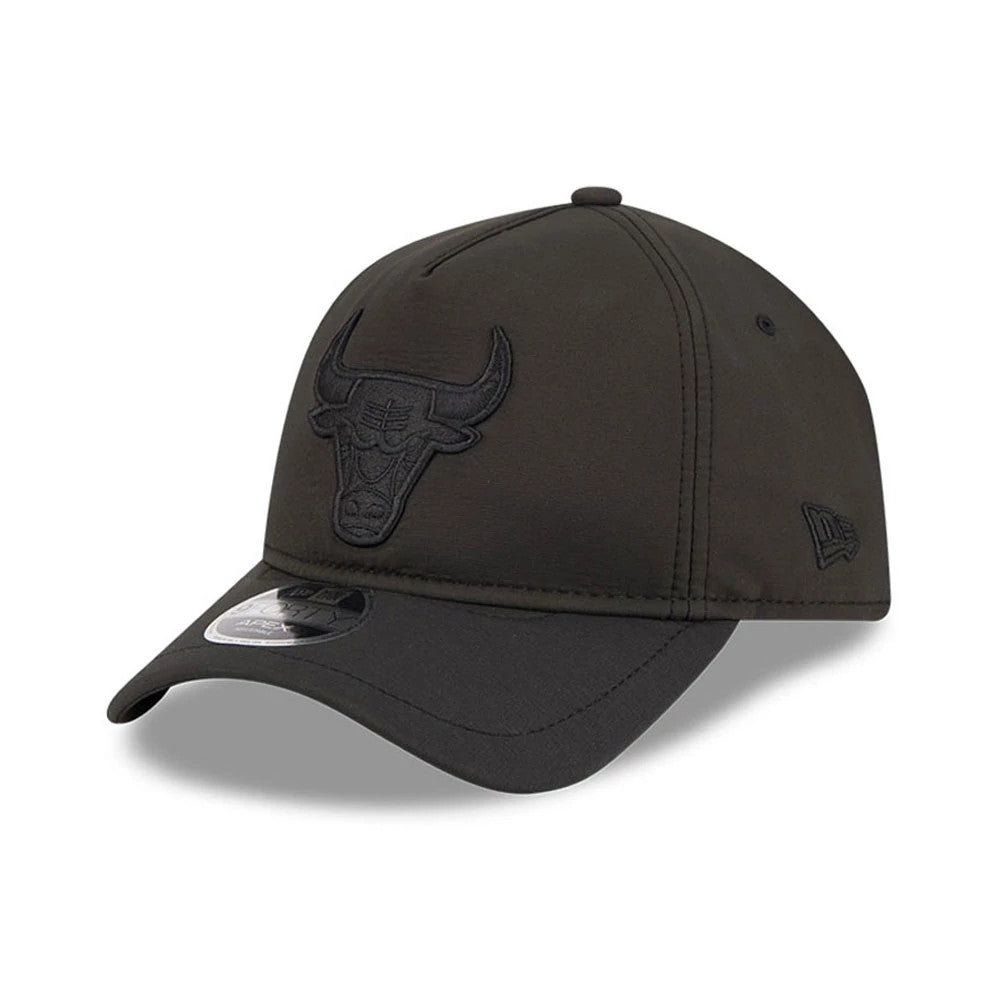 Chicago Bulls NBA Quickstrike Black on Black New Era 9FORTY Apex Adjustable Cap, three-quarter view showing a raised black embroidered bull logo on the front panel, a curved black visor with a 9FORTY size sticker.