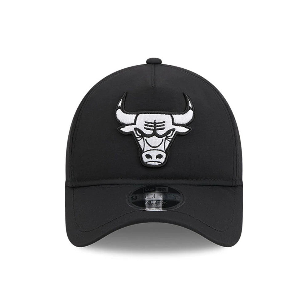 Bulls NBA Quickstrike Black New Era 9FORTY Apex Adjustable Cap, front view showing a raised white embroidered bull logo on the centre front panel, with a black curved visor and a 9FORTY size sticker on the top of the visor.