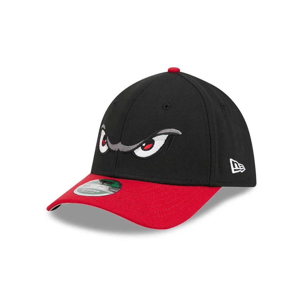 Storm MiLB On Field Black New Era 39THIRTY M-Crown Stretch Fit Cap, three-quarter view showing the distinctive grey and red embroidered eyes on the black front panel, red curved visor with 39THIRTY size sticker.