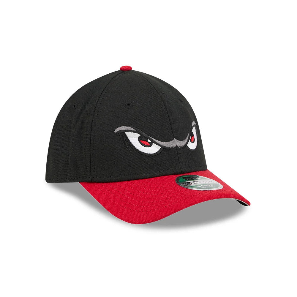 Storm MiLB On Field Black New Era 39THIRTY M-Crown Stretch Fit Cap, three-quarter view showing the white and red embroidered eyes graphic on the front panels, contrasting red curved visor, and the 39THIRTY size sticker on the visor.