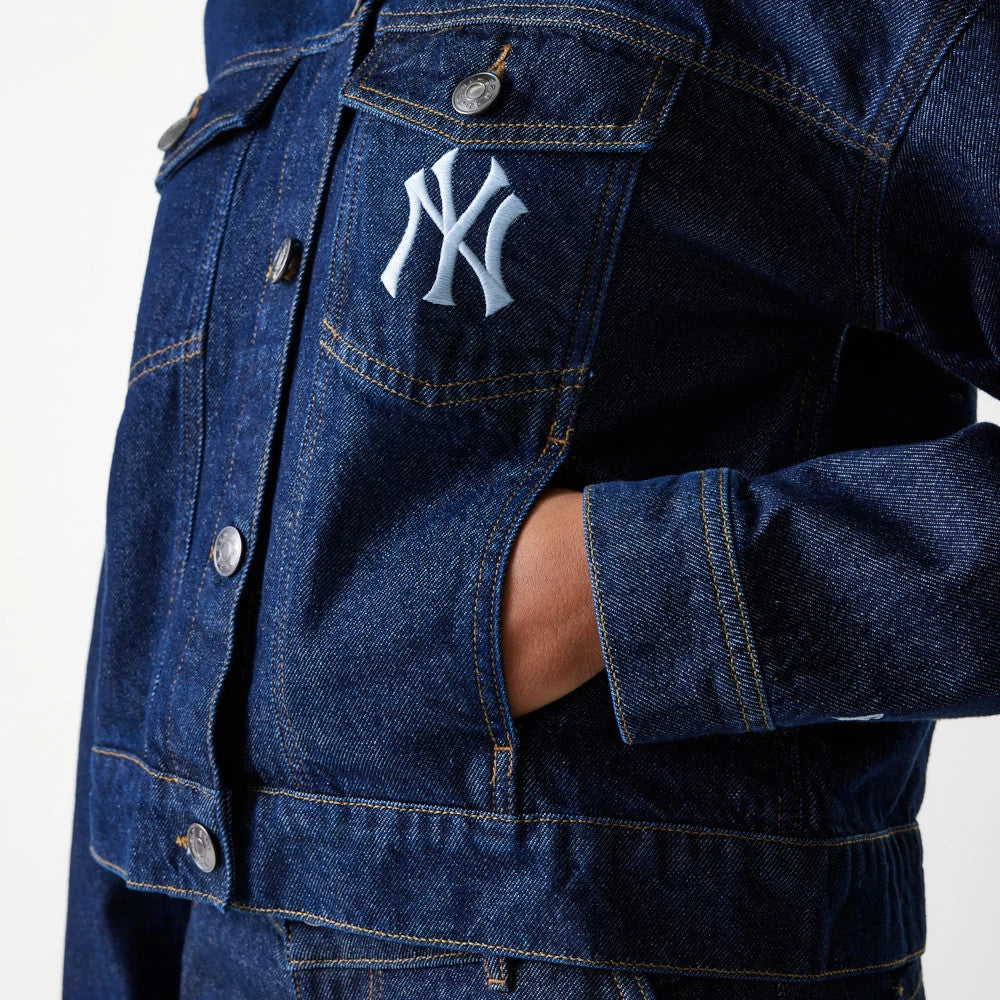 New Era New York Yankees Womens MLB Denim Dark Blue Jacket, front view showing the embroidered white New York Yankees logo on the left chest pocket, silver buttons running down the front, and a relaxed fit with sleeves reaching the wrist.